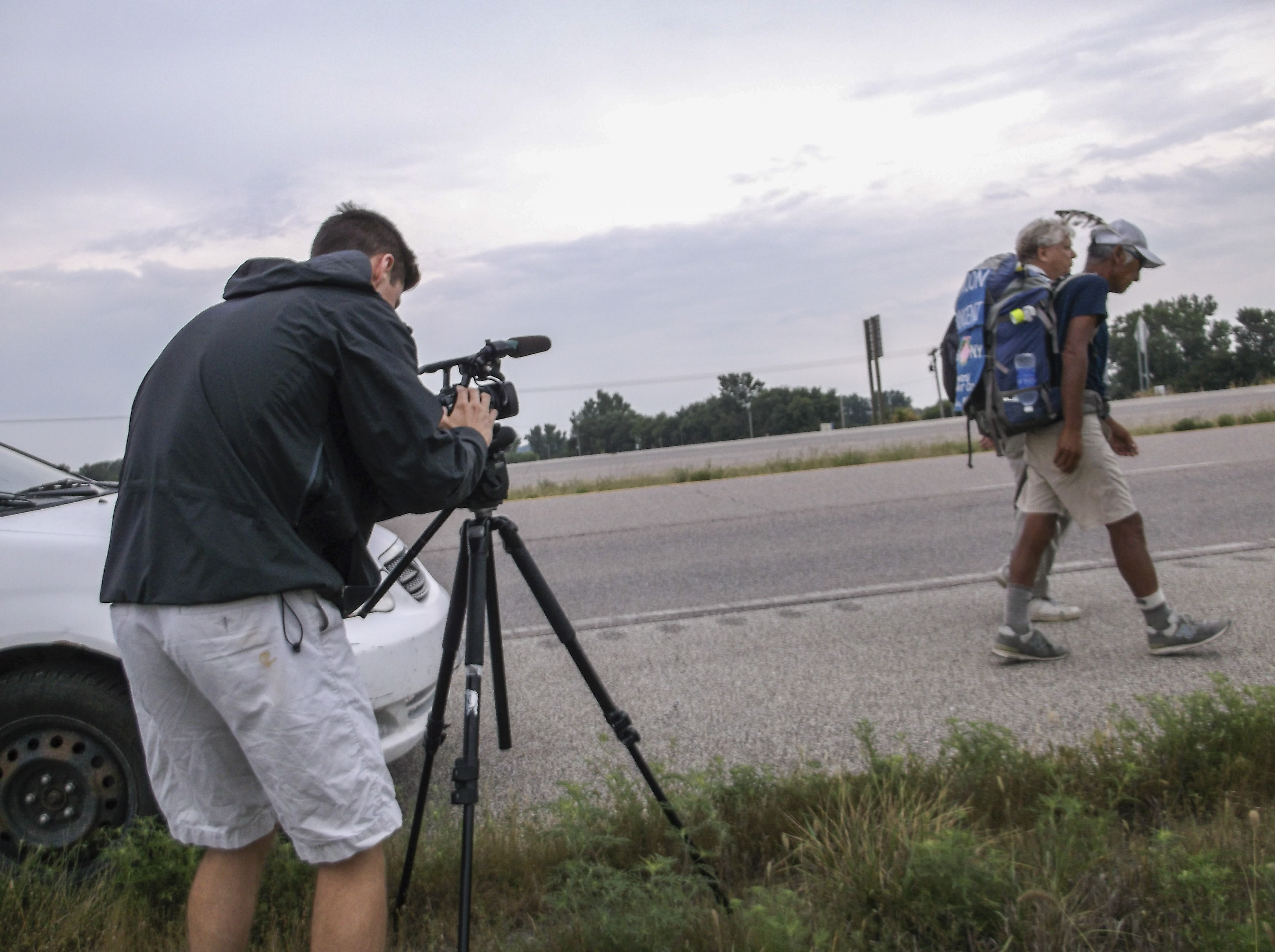 KQ2 news filming Mr Macida walking with Peeter Saarna about to cross Pony Express bridgeedited1