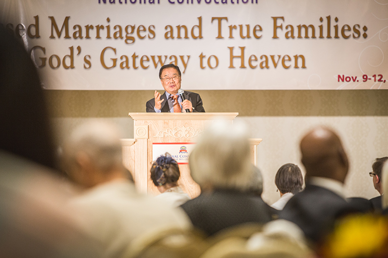 1 Dr. Kim infront of banner